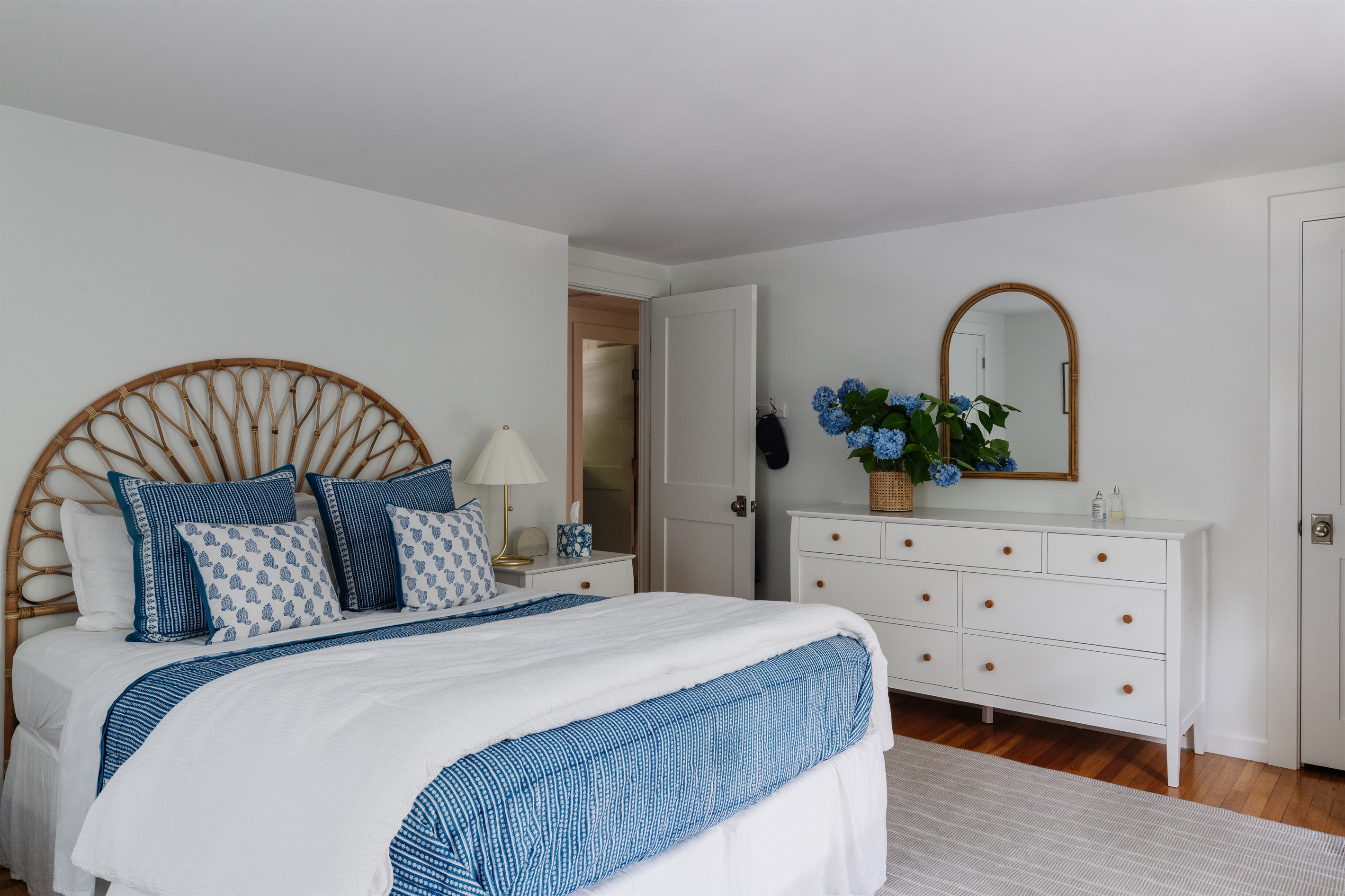 Relax in the second bedroom with a cozy queen bed.