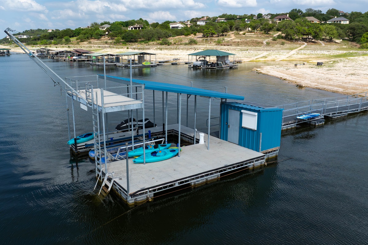 - Private dock with 2 story swing, paddleboards & kayaks for lakeside adventure - Calm water setting ideal for fishing swimming and fun memories - Easy access point for exploring the lake throughout your stay.  Jet ski not included