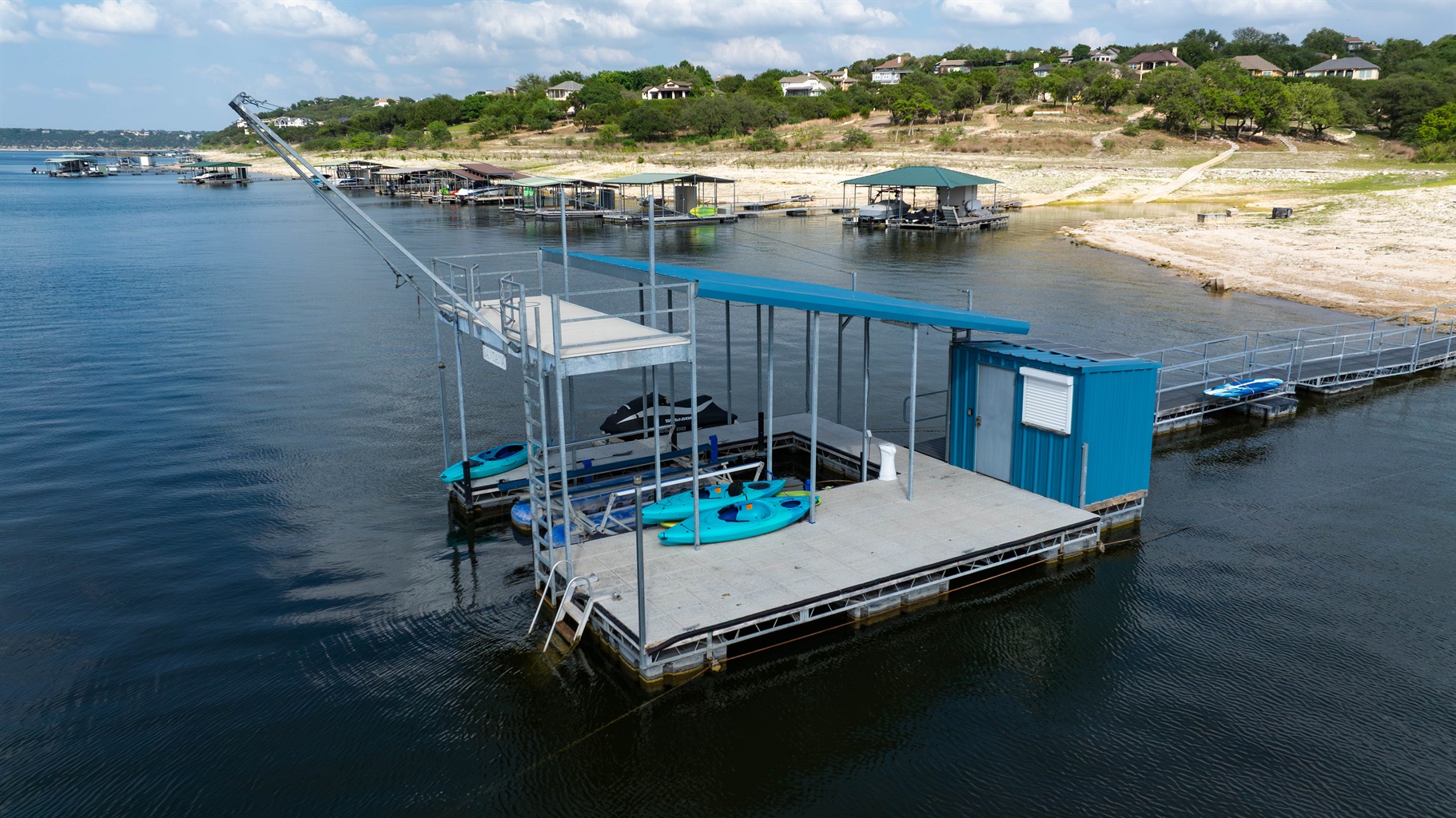 - Private dock with 2 story swing, paddleboards & kayaks for lakeside adventure - Calm water setting ideal for fishing swimming and fun memories - Easy access point for exploring the lake throughout your stay.  Jet ski not included