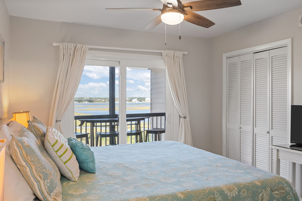 Master bedroom offers direct balcony access