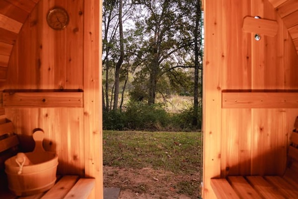 The sauna offers a peaceful retreat with serene views, perfect for unwinding in nature’s embrace.