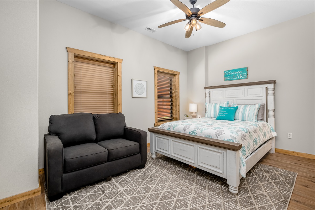 Queen bedroom with twin sleeper sofa and attached bath