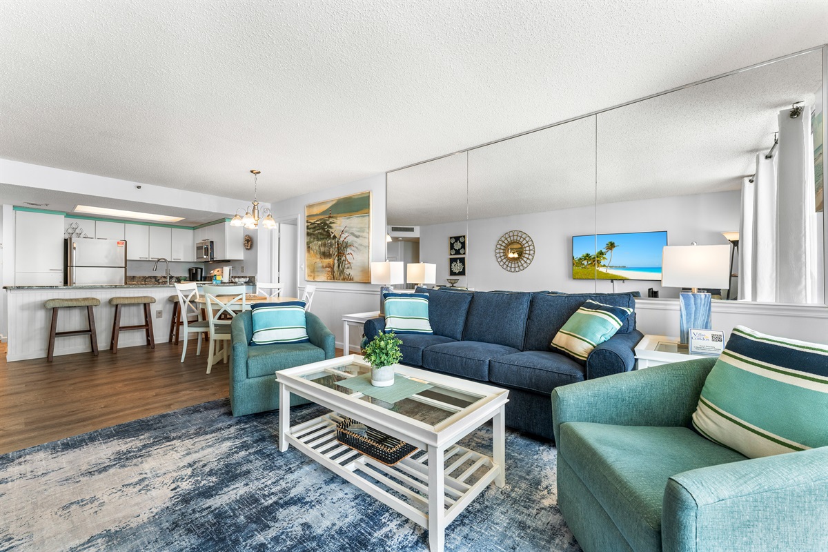 Large Living room area with balcony access and sleeper sofa