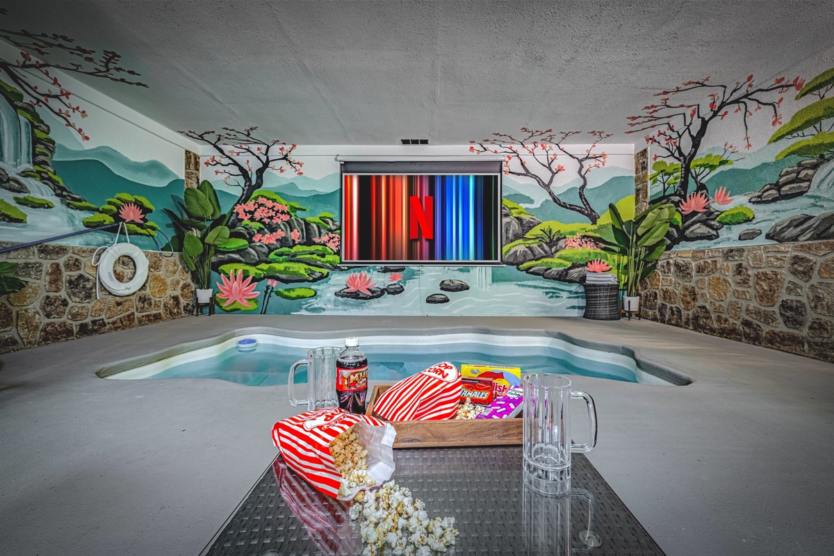 Your own private indoor pool — complete with movie nights on the big screen  Property Managed By KickbackStays.com
