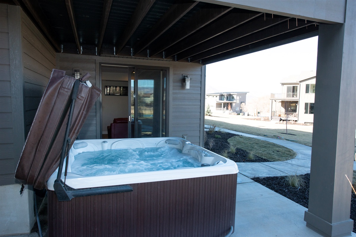 Step outside to your private covered patio and soothing hot tub