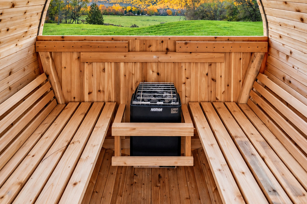 Interior sauna with wooden benches and heater