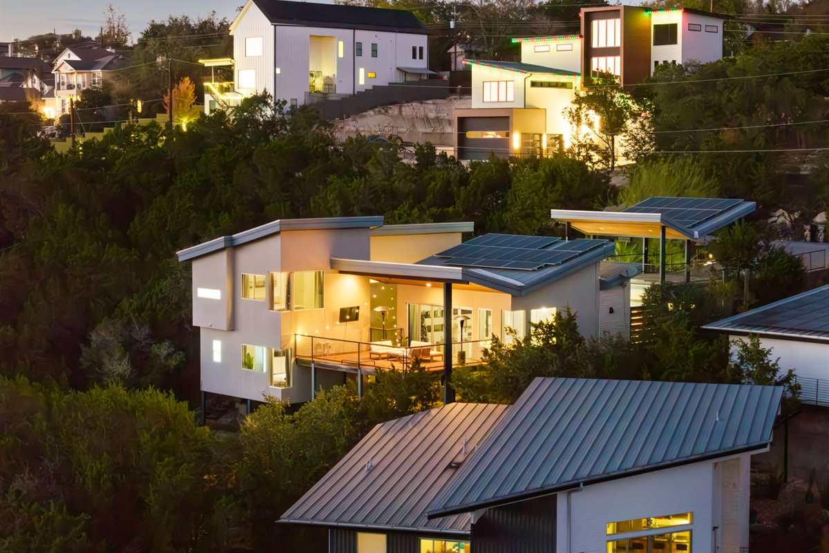 Twilight exterior highlighting the home’s modern architecture