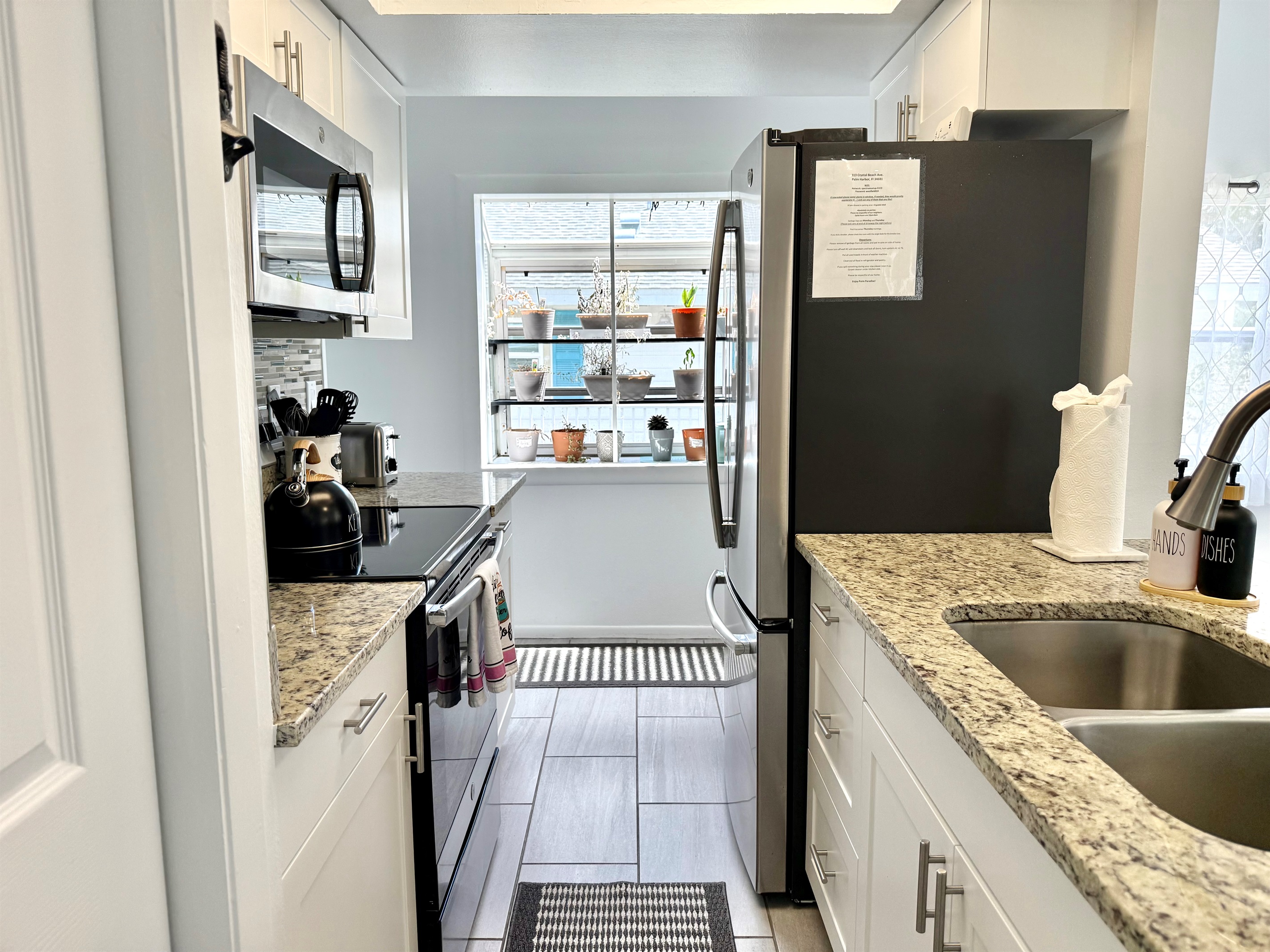 The kitchen’s open pass-through design keeps you connected with guests in the dining room while you cook.