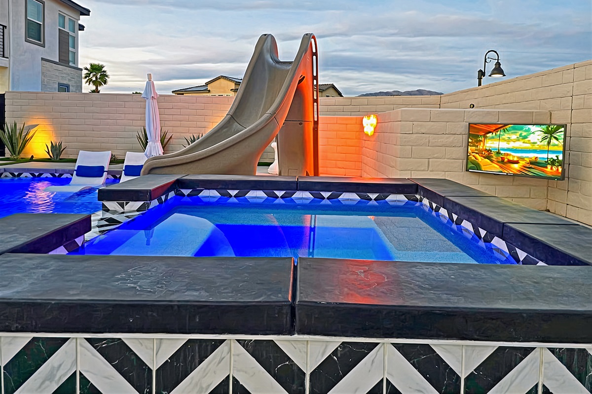 Outdoor TV next to the spa. Never miss your favorite sports game or show.