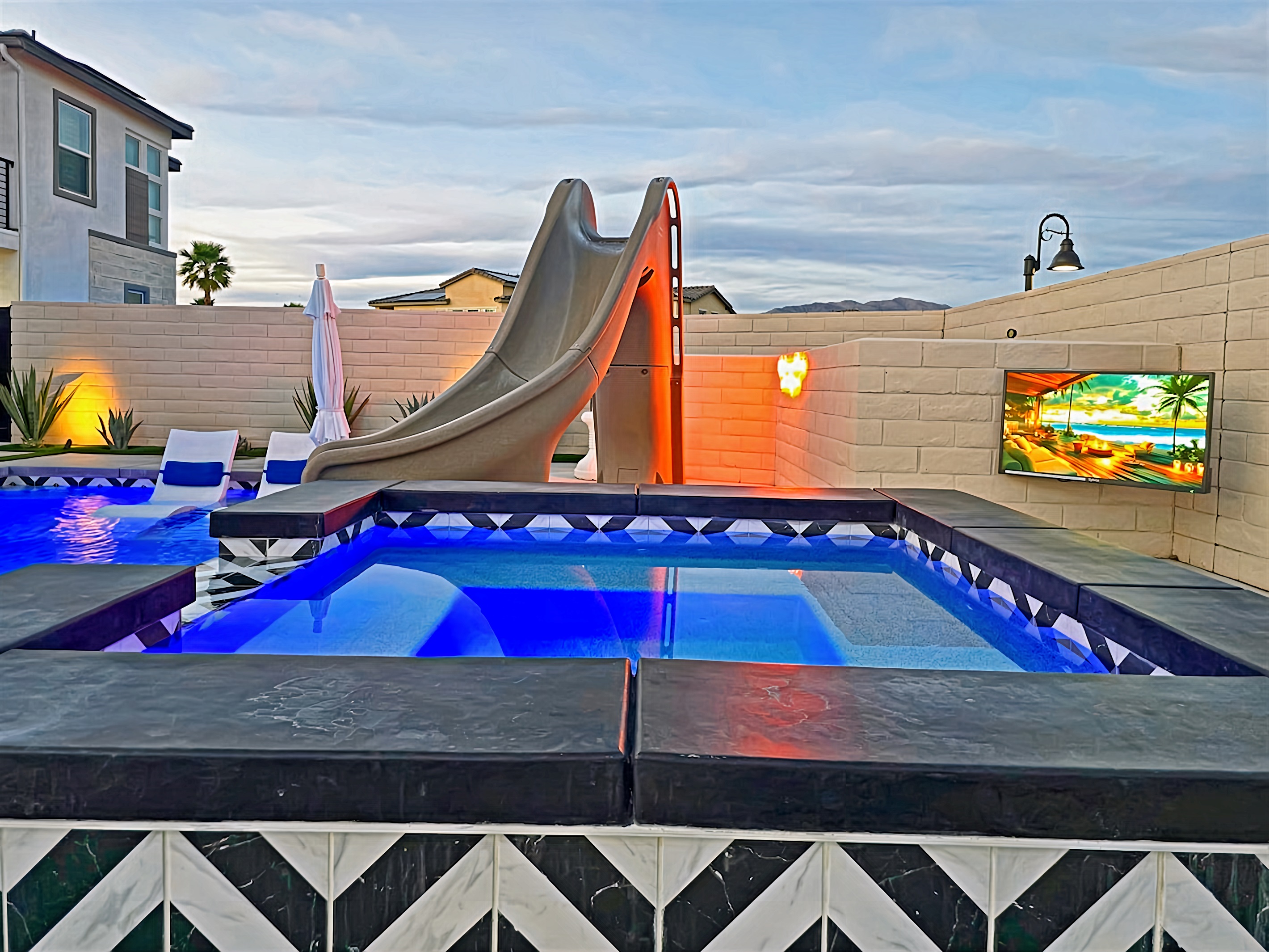 Outdoor TV next to the spa. Never miss your favorite sports game or show.
