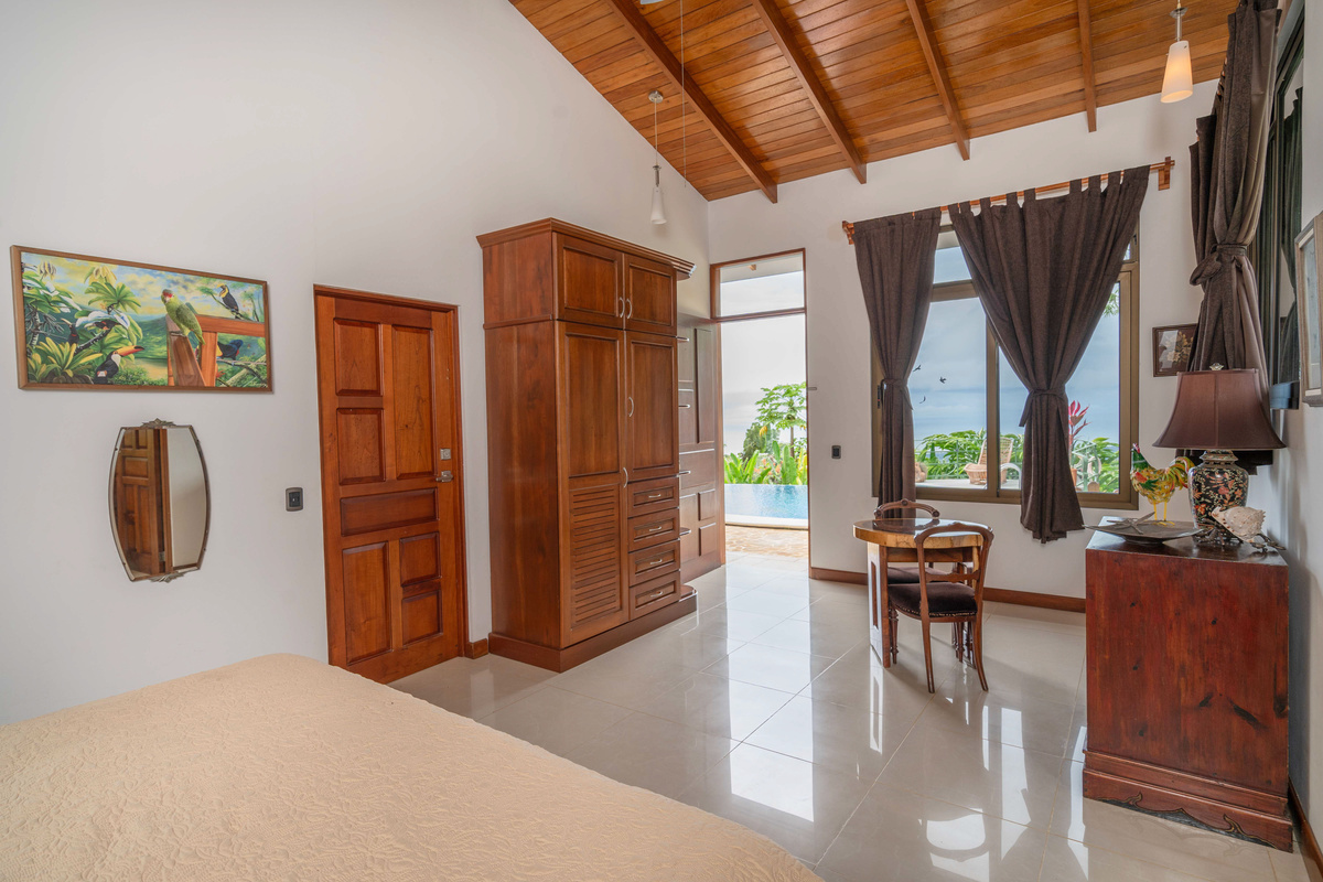 Bedroom entry with custom hardwood doors and private terrace access