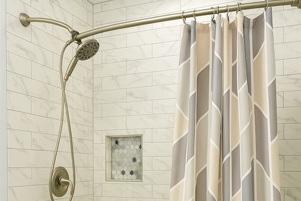 A clean, modern walk-in shower with fresh tile and simple design — ideal for refreshing after a day exploring Raleigh. (intentional repeat, slightly reworded) 