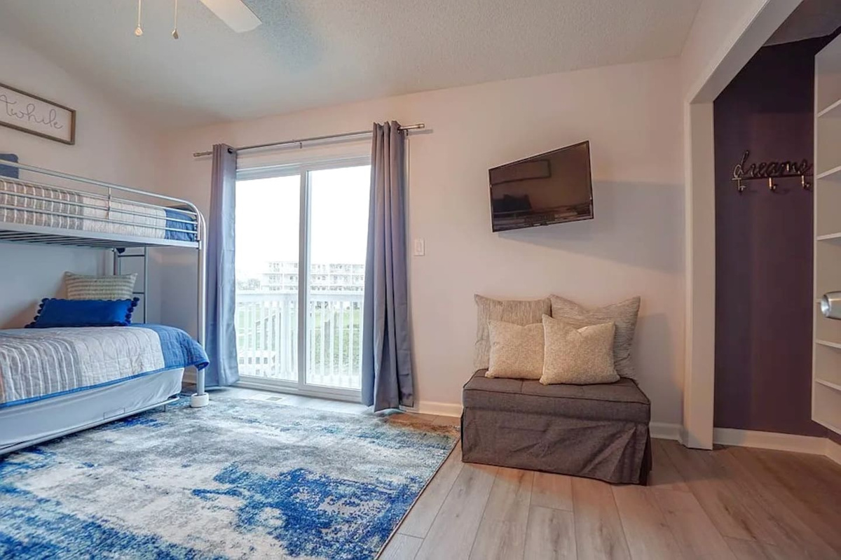 You'll love how much this room delivers &mdash; Smart TV for movie nights, a private balcony the kids will claim as theirs, and real storage for gear.