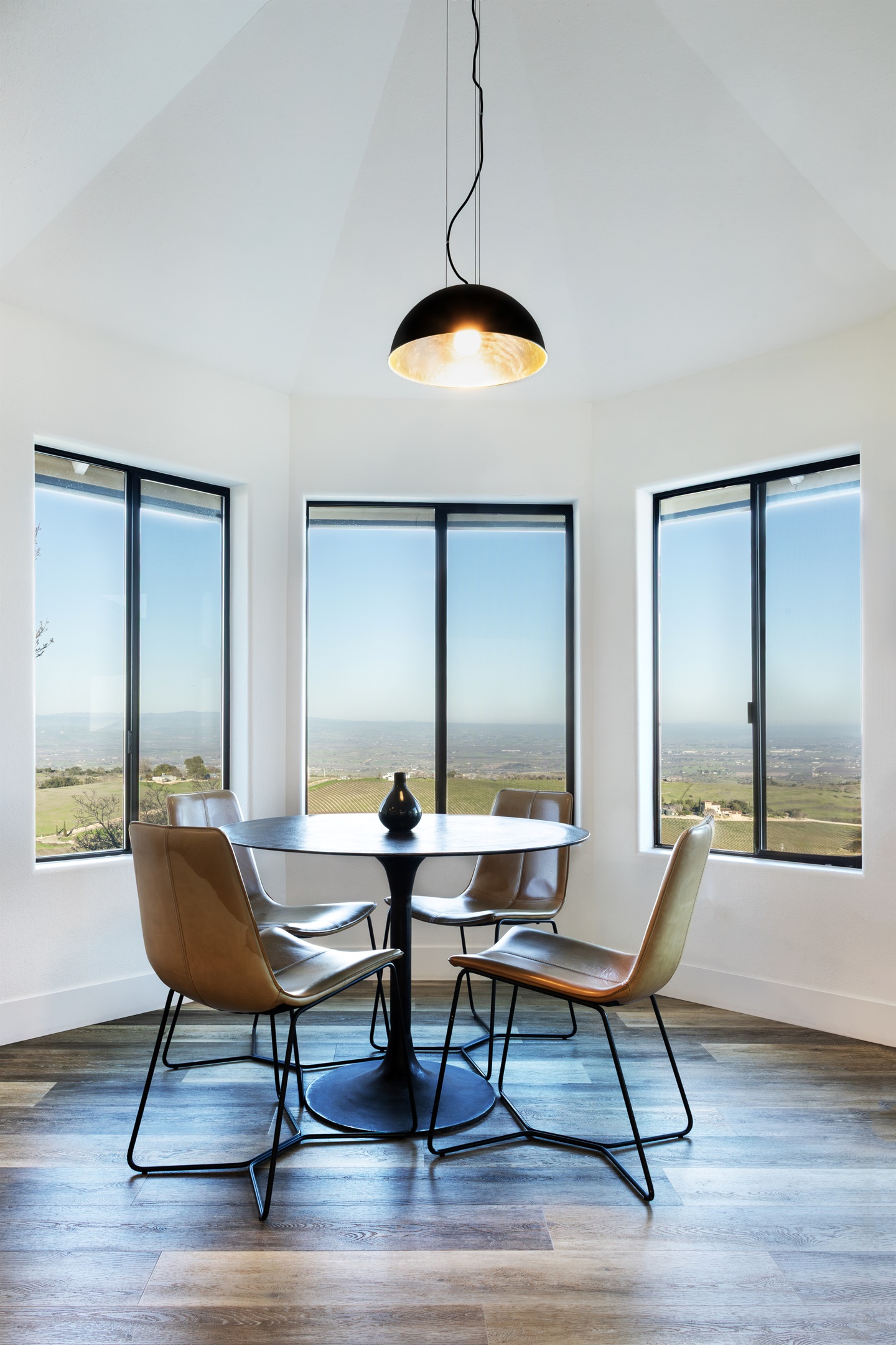 Possibly the best seat in wine country. This intimate four-person turret nook is wrapped in panoramic windows overlooking the vineyard and the entire Paso Robles valley — where every meal feels like a special occasion.