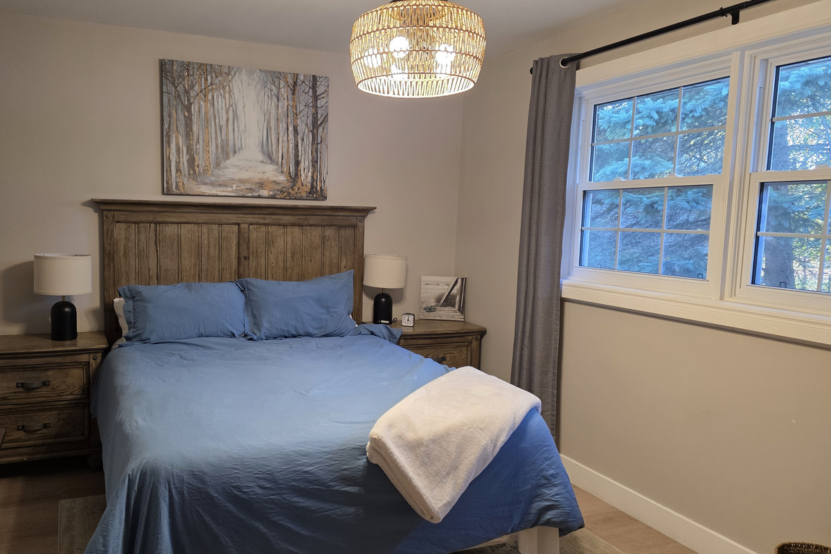 Bedroom 2: your quiet retreat with TV, dresser, closet, chair, USB lamps, electric fireplace and 2 plush robes for cozy nights in or a trip to the hot tub.