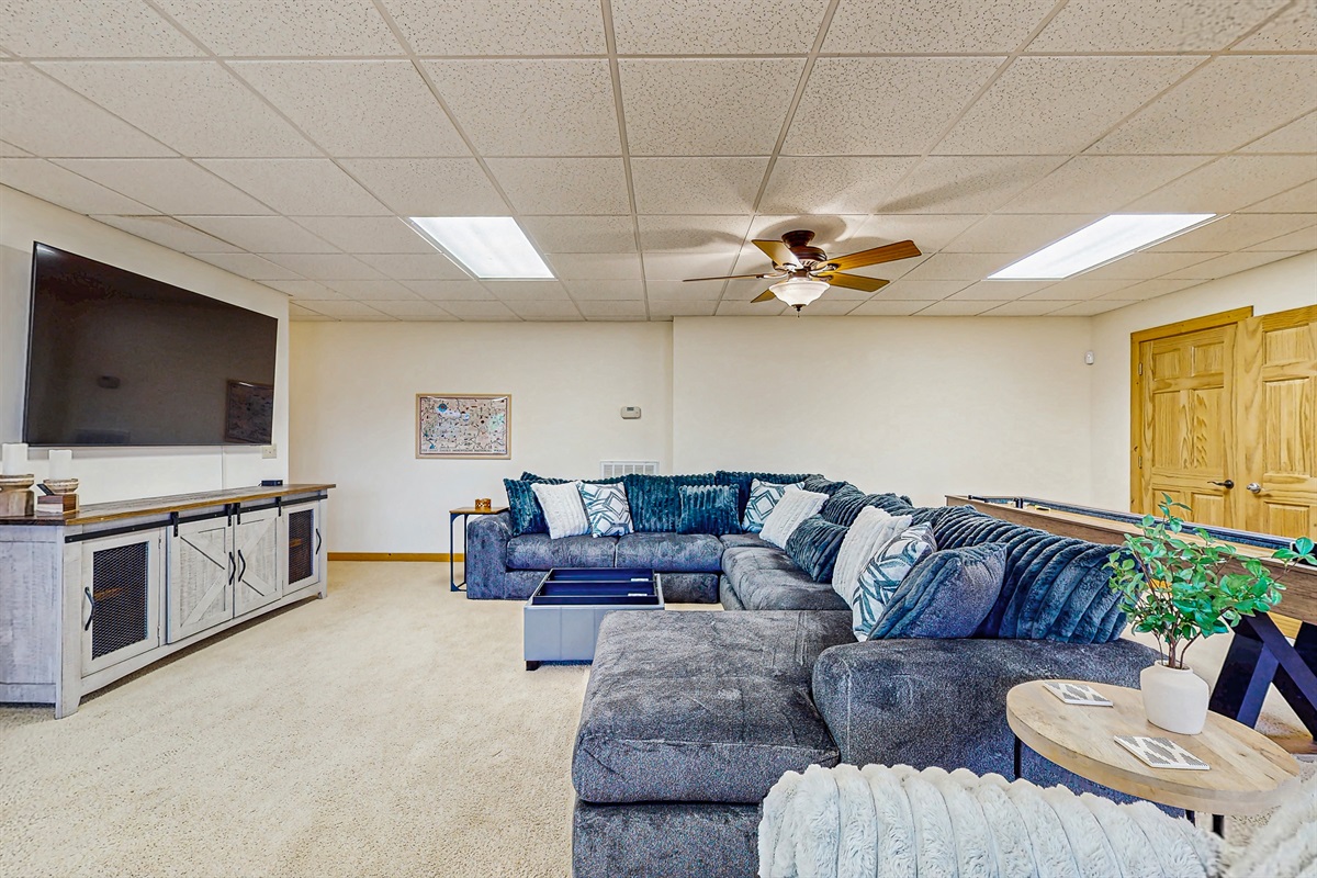 Huge gathering space overlooking lake, wet bar, game table, shuffleboard, pool table, foosball 