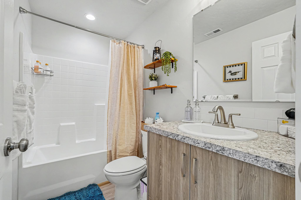 The upstairs bathroom has a nice tub for soaking in after a long day of exploring or working. 