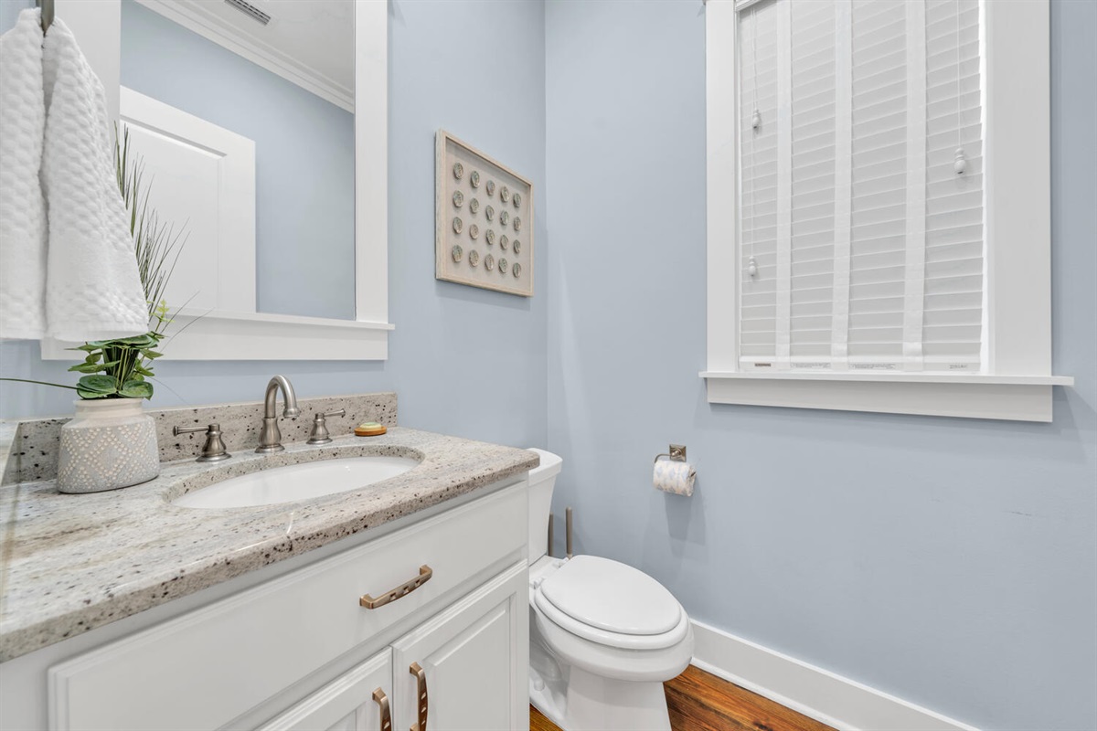 Main floor half bath for quick, convenient access.