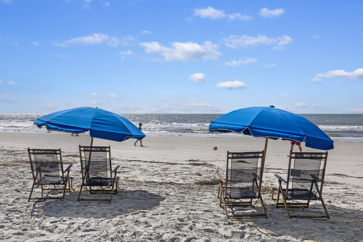 Your perfect beach day awaits on the beautiful shores of South Forest Beach, just steps from the villa.