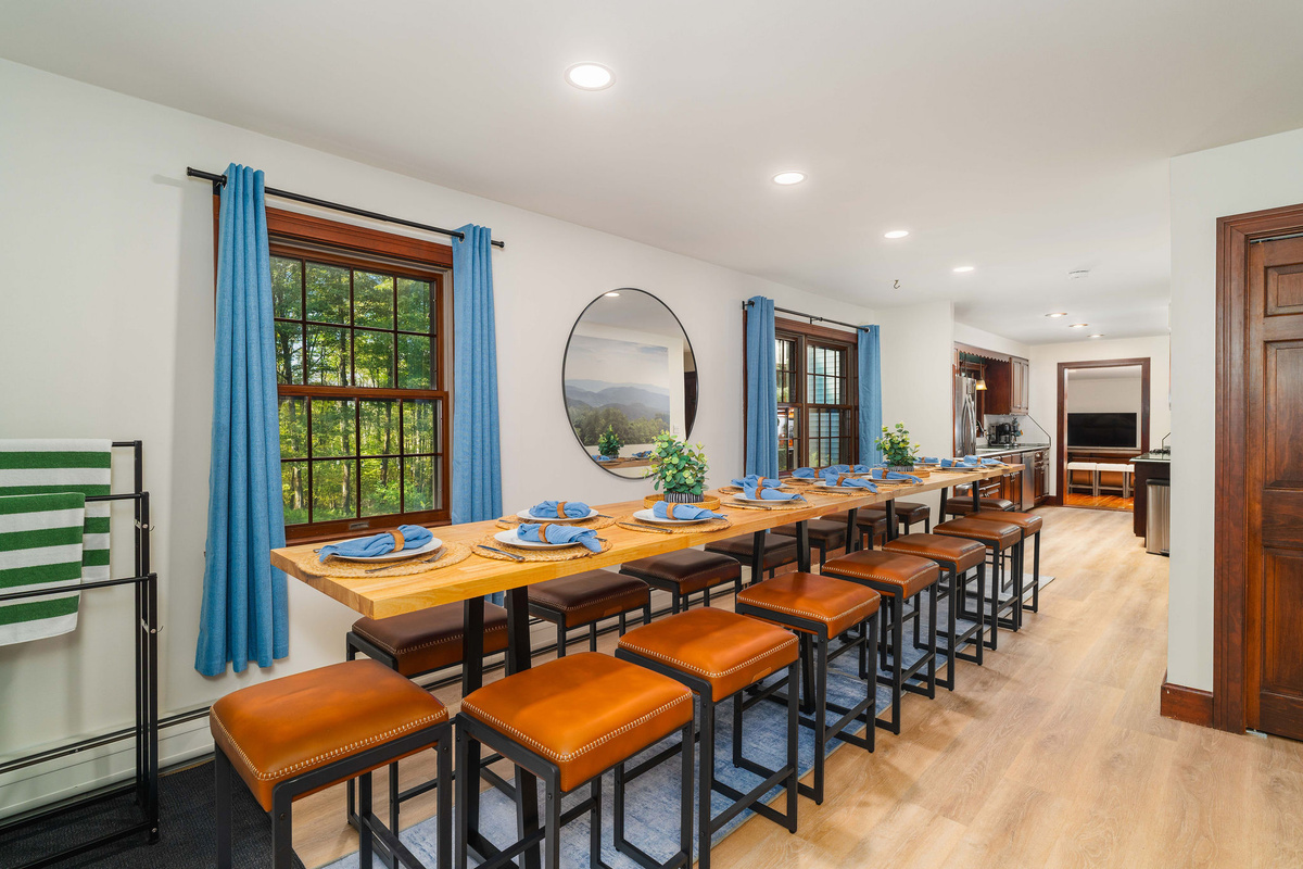 🍽 Custom-built dining tables seat 16 — big enough to put the whole house at one table.