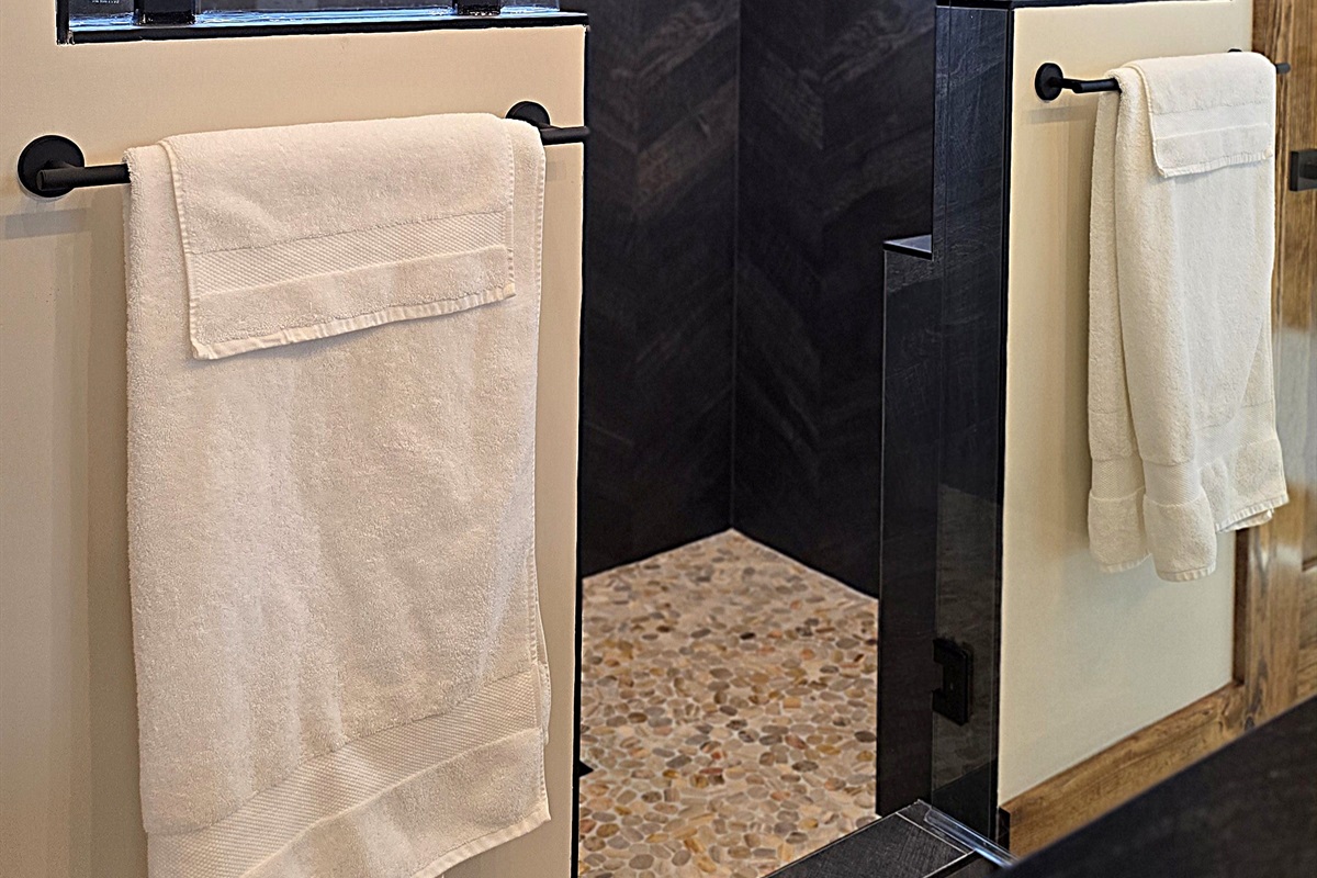 Two-person walk in shower with glass door