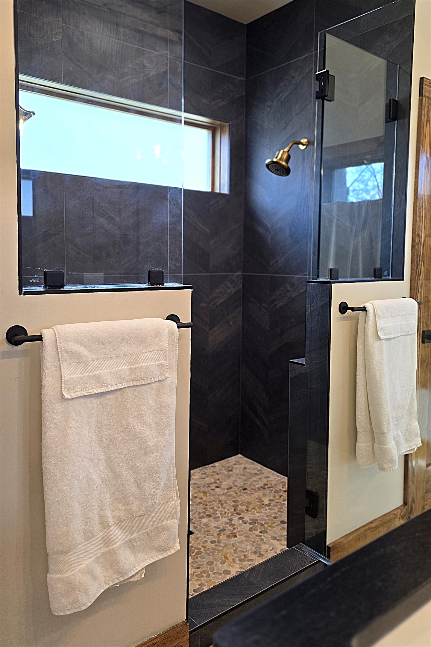 Two-person walk in shower with glass door