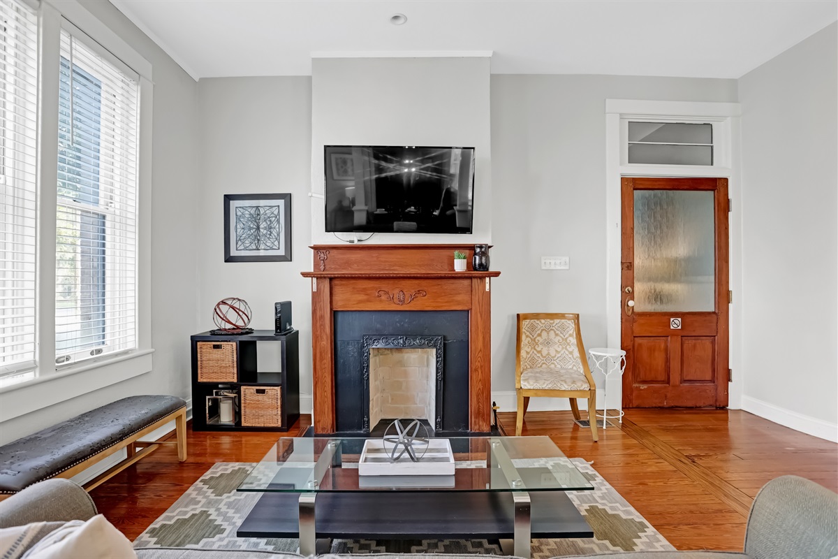 Cozy up by the decorative fireplace, a charming centerpiece that adds character.