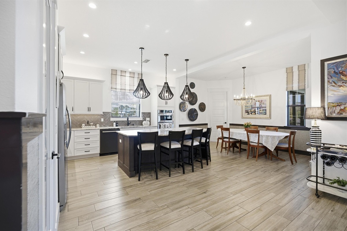 Open-concept gathering space for the whole crew 🍽️✨
A bright chef’s kitchen, oversized island seating, and a spacious dining area make it easy to cook, connect, and linger over long meals—this is where vacation memories get made.