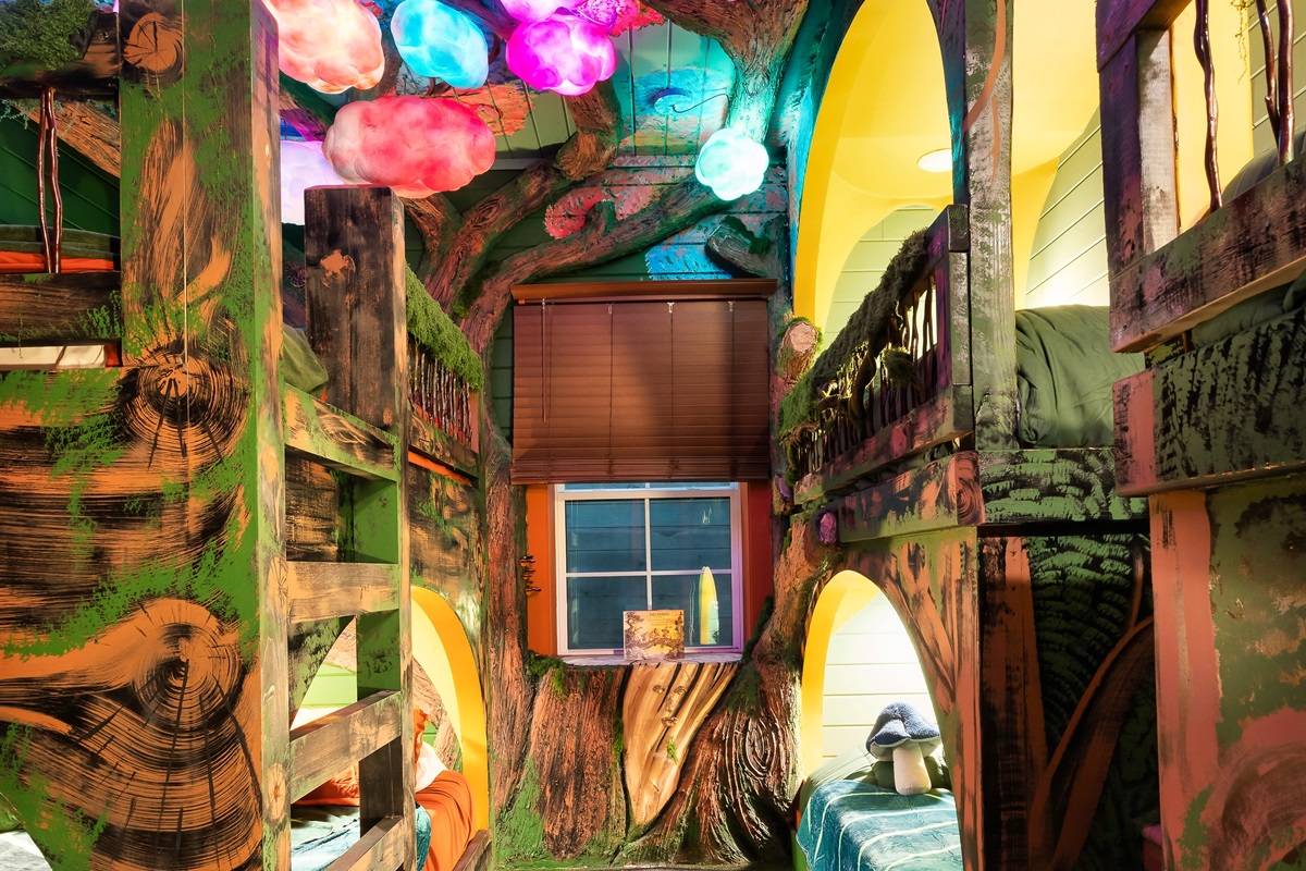 Downstairs bunk roomthe forest canopy ceiling glows and shimmers with magical colors