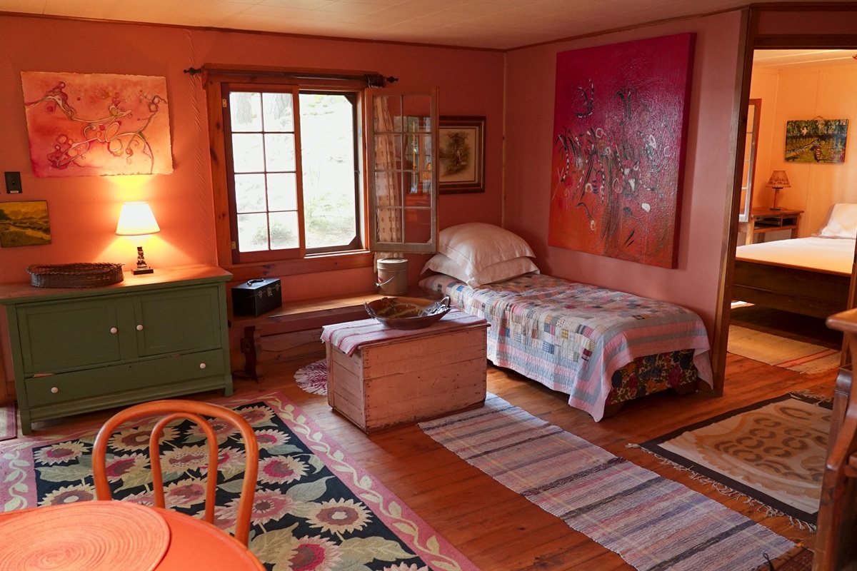 Living room in cottage has futon that can be made into bed if needed.