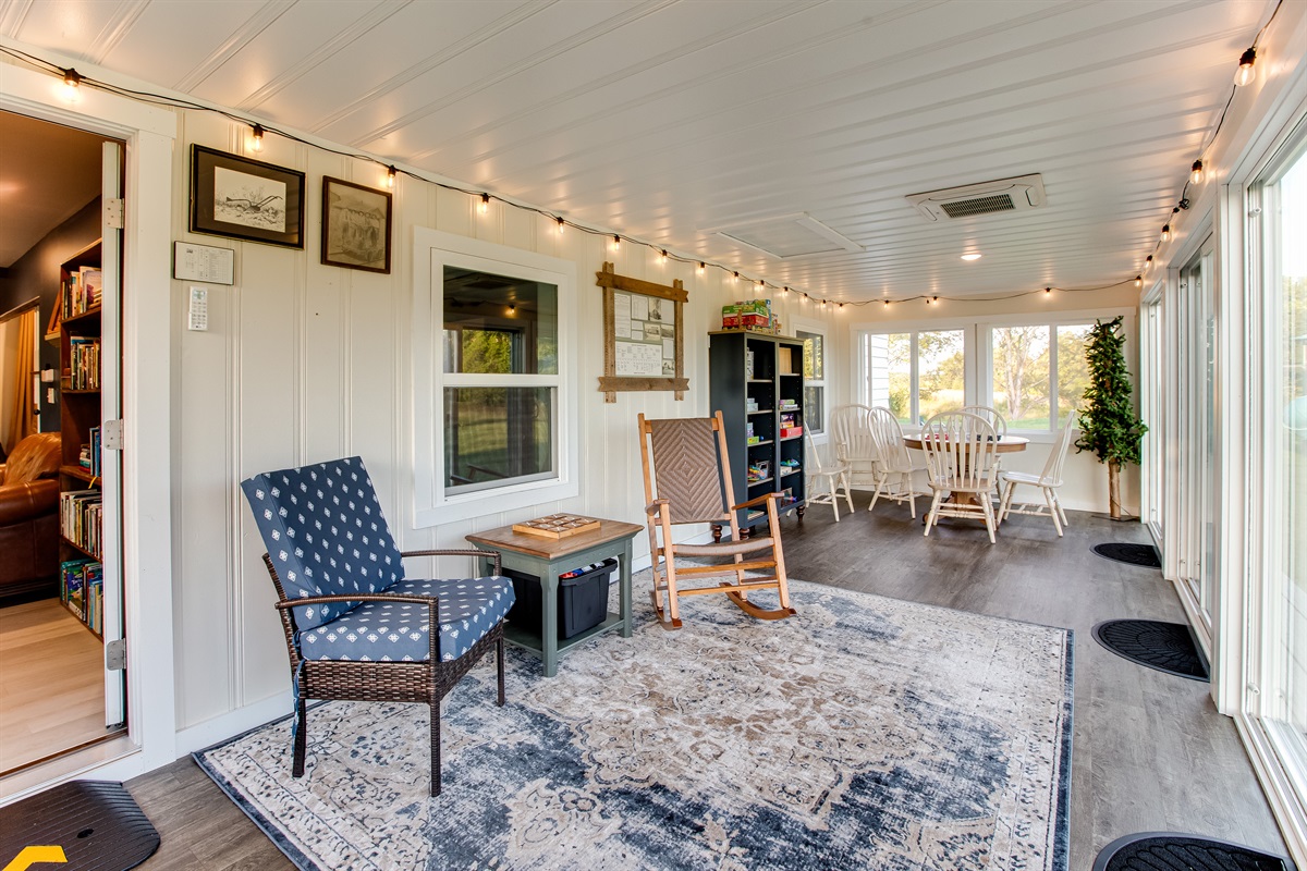 The sunroom is a guest favorite for watching nature, reading books or playing games.