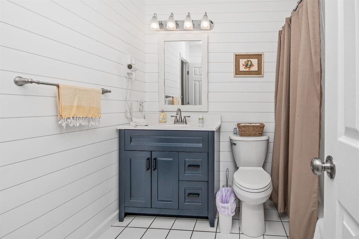 Enjoy this 2025 brand new shared full bath.  This shared bathroom is accessible from bedrooms 2 and 3. 