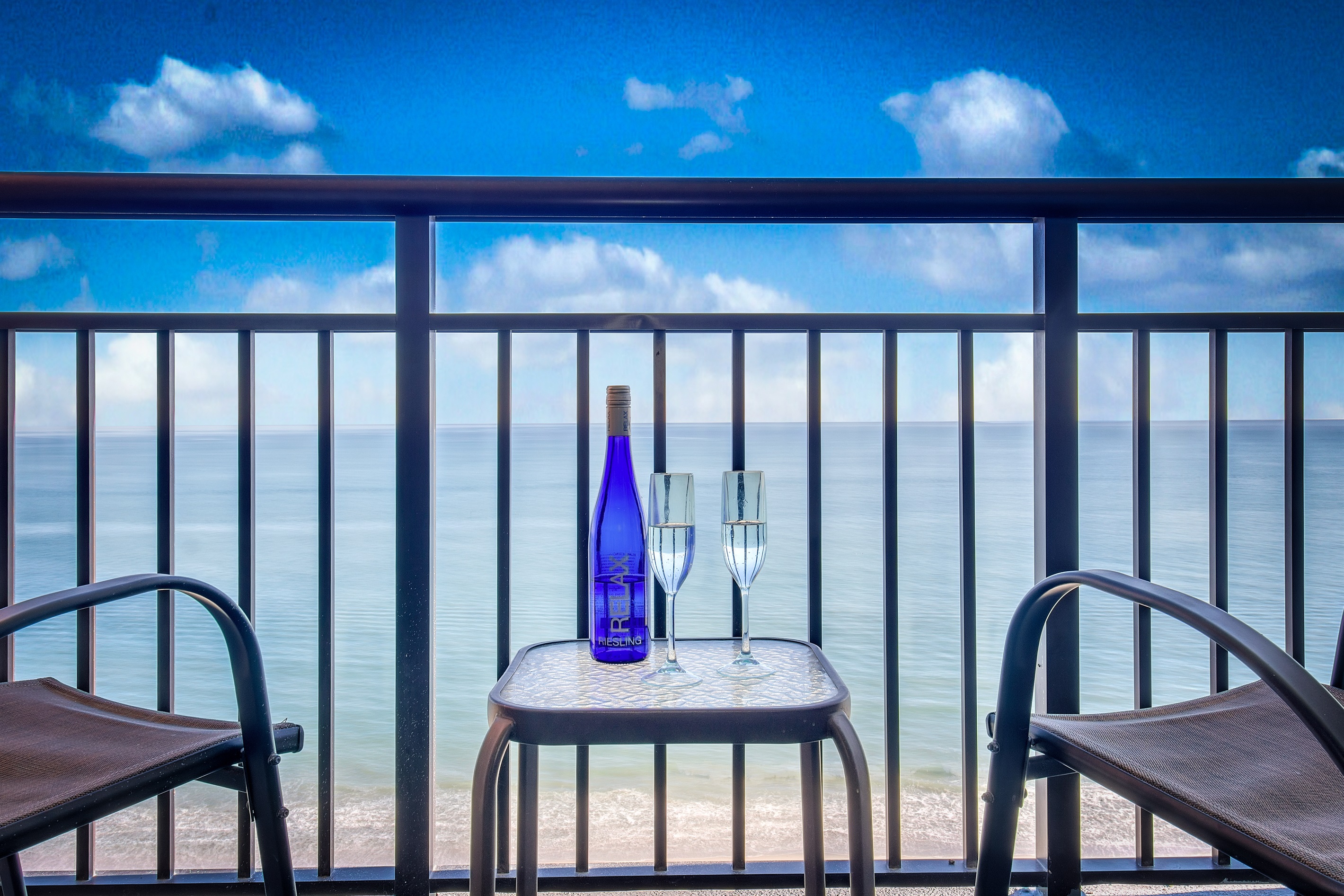 Sit back, relax and sip a cup of coffee while enjoying the front row seat view of the skyblue sea.