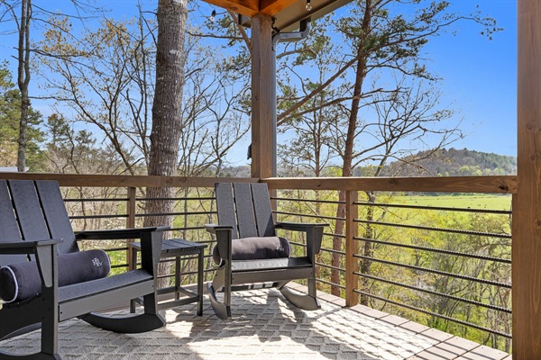 Just outside of the master bedroom, on the upper deck, are two comfortable Polywood rocking chairs with lumbar pillows. The perfect spot to sip a morning cappuccino or relax and watch the sunset while taking in the view.
