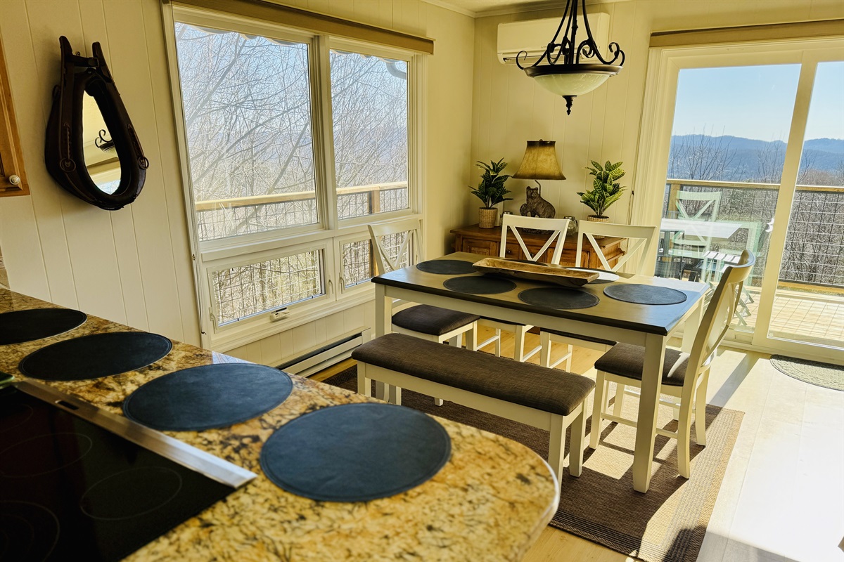 Dining with amazing views! Our dining table seats 6 (with 4 chairs + 1 bench that seats 2 more) & 4 barstools that are adjacent to this table, under the kitchen counter bar to seat 10 total.