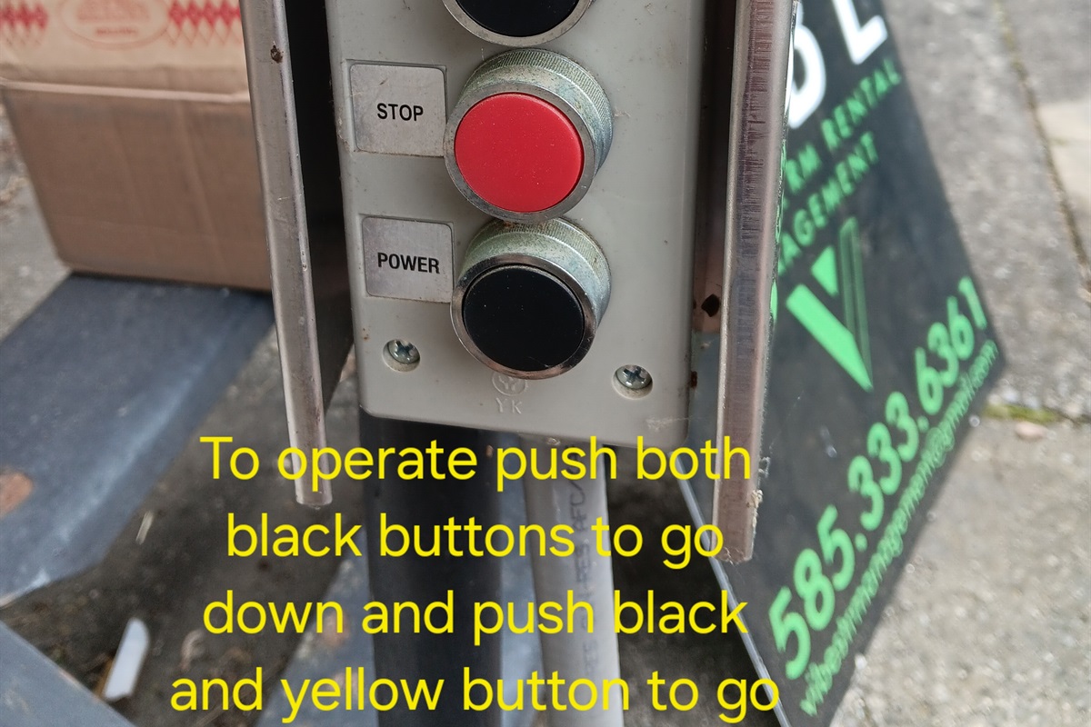 To operate tram push both black buttons to go down and black and yellow to go up