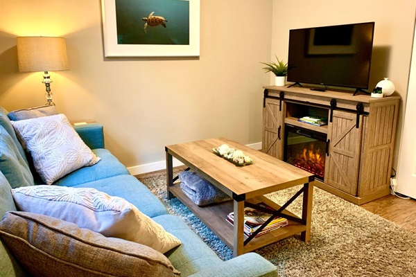 Cozy Living room with infrared fireplace and adjustable heat.