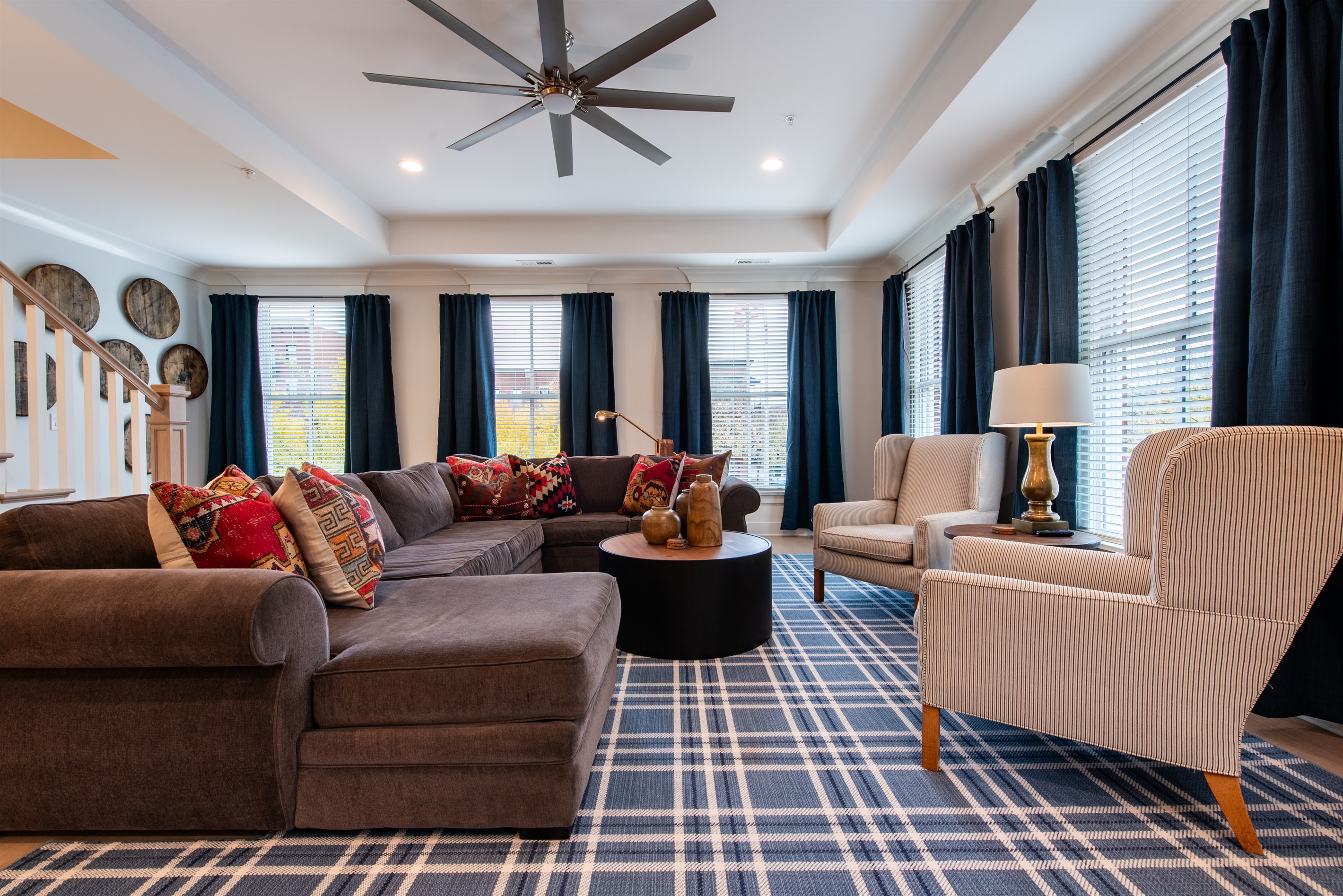 Relax in this stylish living room, perfect for unwinding after a day on the Kentucky Bourbon Trail. Enjoy the cozy sectional, bourbon-themed decor, and ample seating for sharing stories of your bourbon adventures. Your perfect trailside haven!