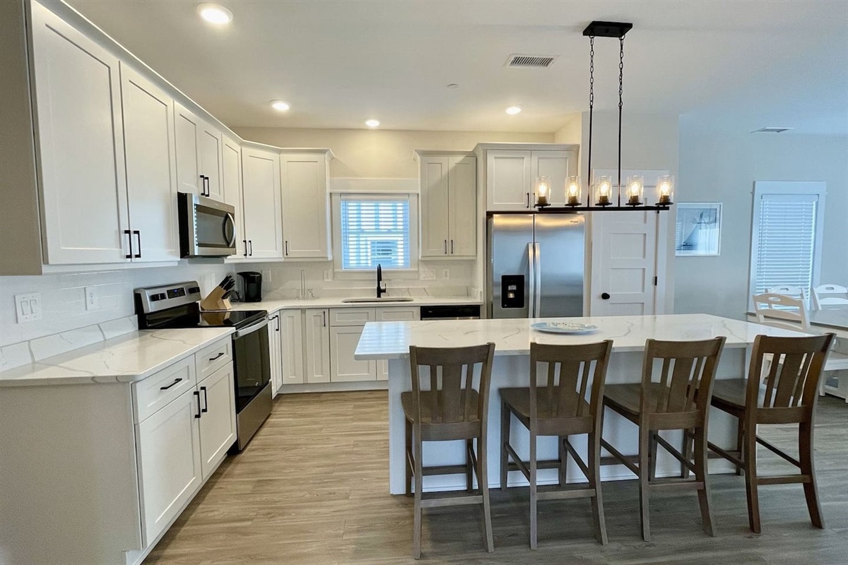 Fully equipped kitchen with a large island, perfect for cooking and gathering