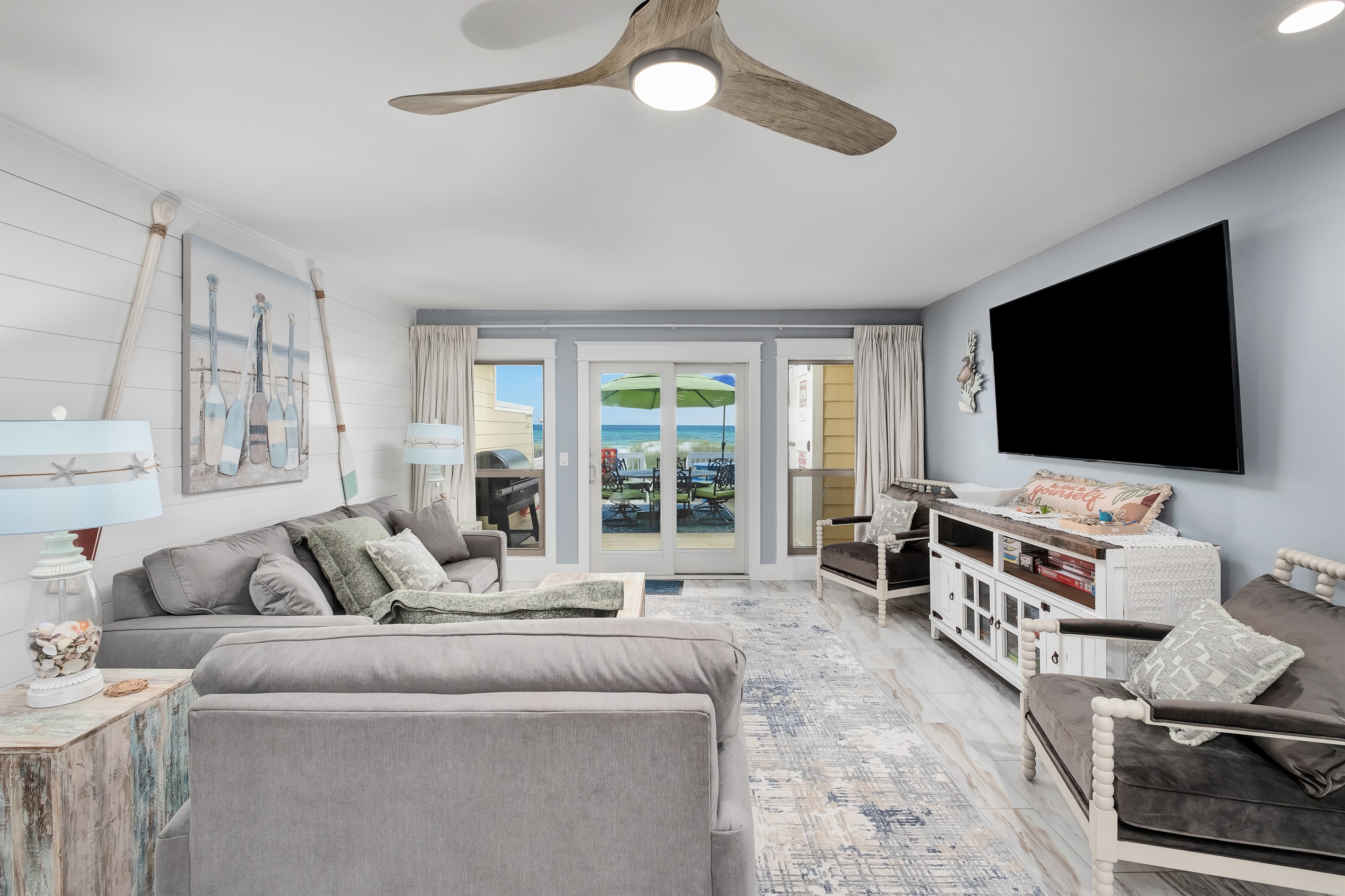 Relax in the spacious living room with direct access to the beachfront deck. Ideal for enjoying the ocean breeze.