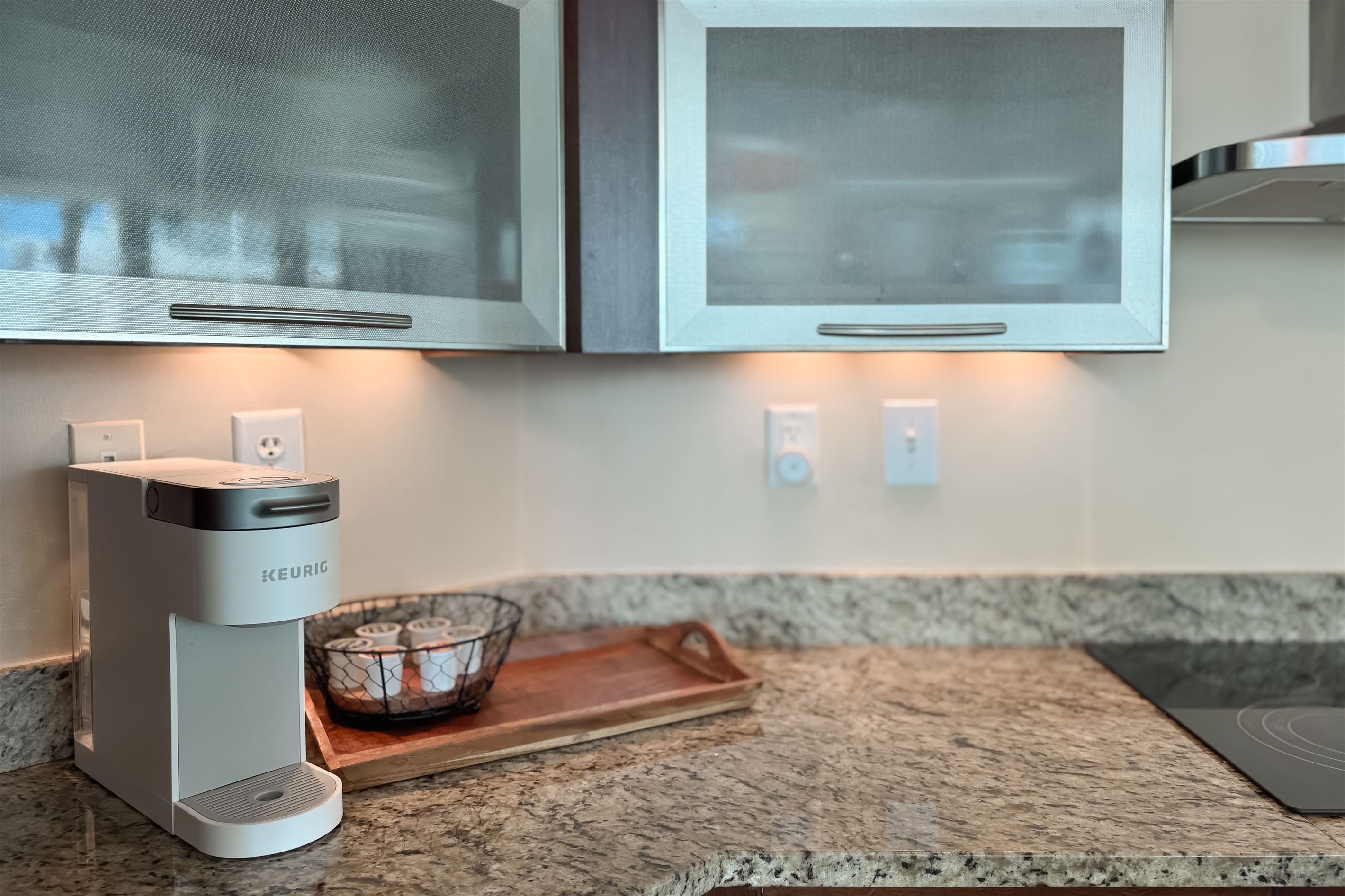 Modern kitchen essentials at your fingertips. This countertop setup offers everything you need for a quick breakfast or a relaxing cup of coffee.