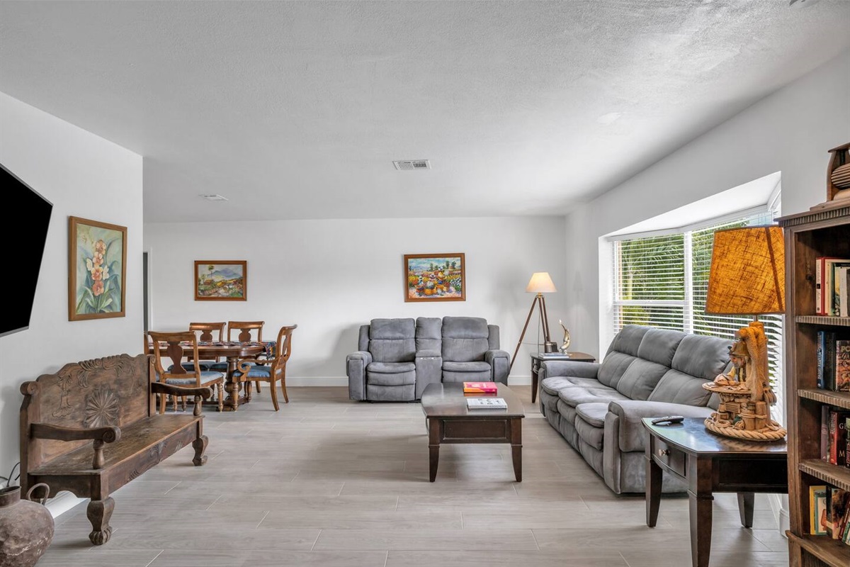 Living room with ample comfortable seating.