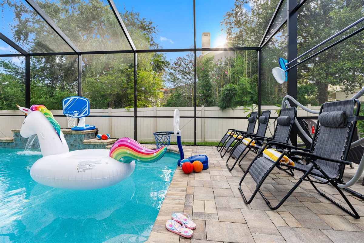 Enjoy the outdoors without the hassle—this entire pool area is enclosed with a full-screen structure, keeping bugs and debris at bay while still letting in plenty of sunlight and fresh air.