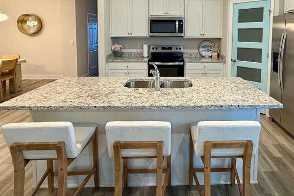 Kitchen island with plush stools