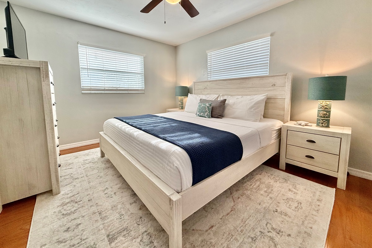 Designed for rest and rejuvenation, the master suite offers a luxury king bed, blackout blinds, and tasteful decor.