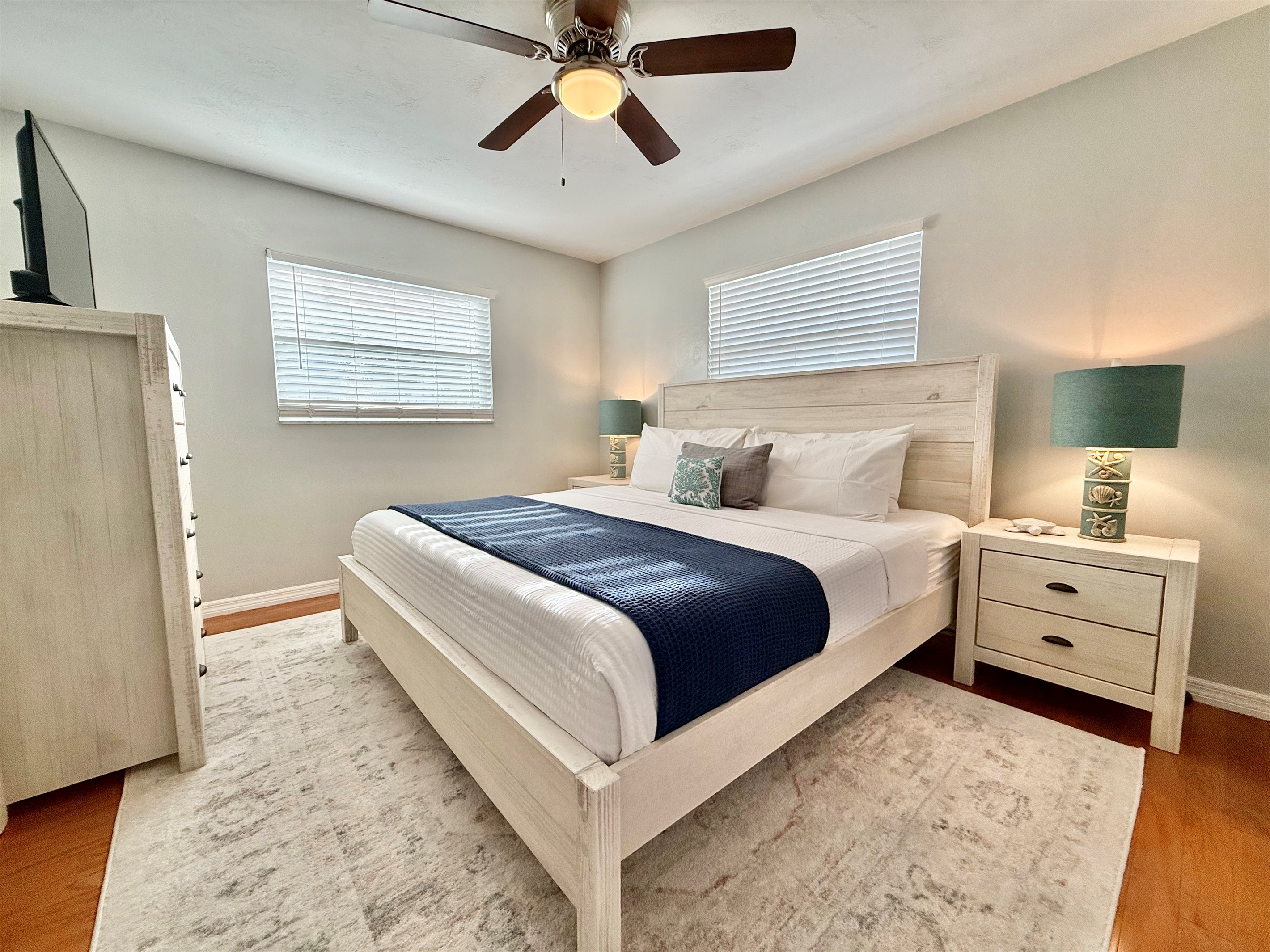 Designed for rest and rejuvenation, the master suite offers a luxury king bed, blackout blinds, and tasteful decor.