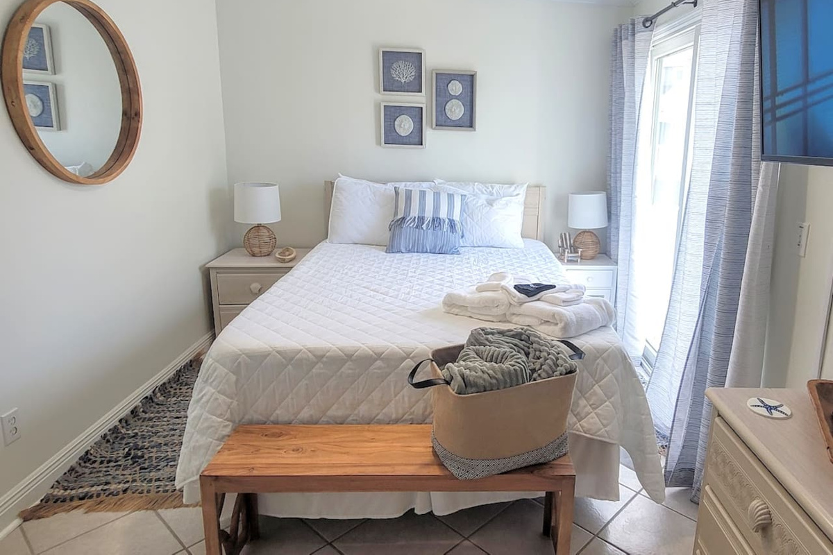 Step onto the private balcony from the queen bedroom whenever you need a moment &mdash; fresh Gulf air without leaving your room.