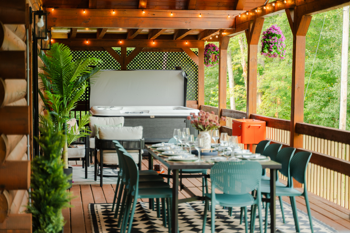 Soak in the hot tub while taking in the peaceful wooded setting.