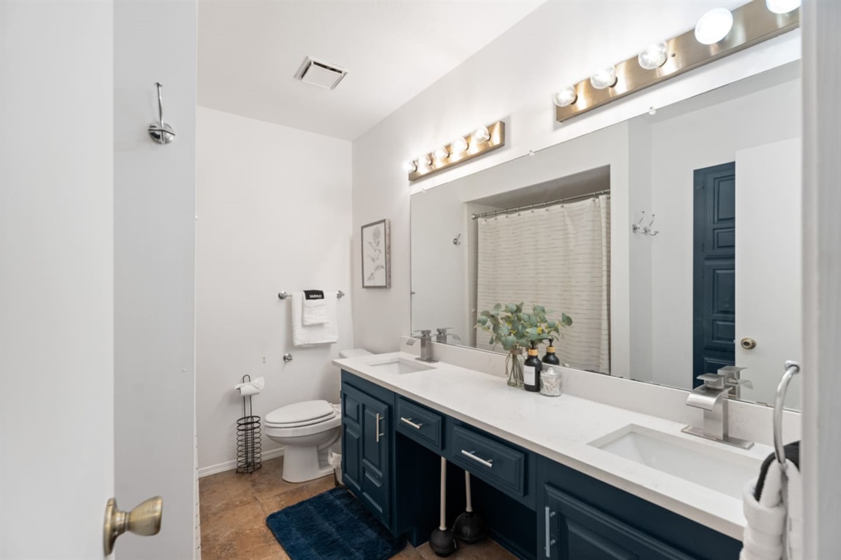 Stylish bathroom with double sinks and contemporary finishes.
