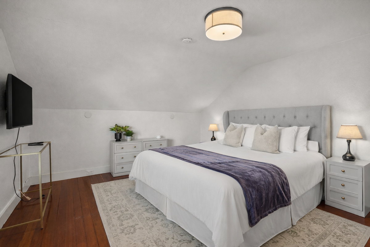 Unwind in the spacious primary bedroom featuring a comfortable king bed, Smart TV, and a large closet for all your belongings. Designed with comfort in mind, it's the perfect private retreat after a day of exploring Napa Valley.